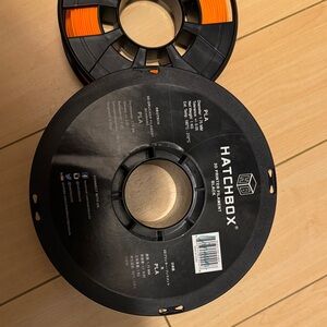 Hatch Black and Orange PLA Filament Spool (used)
